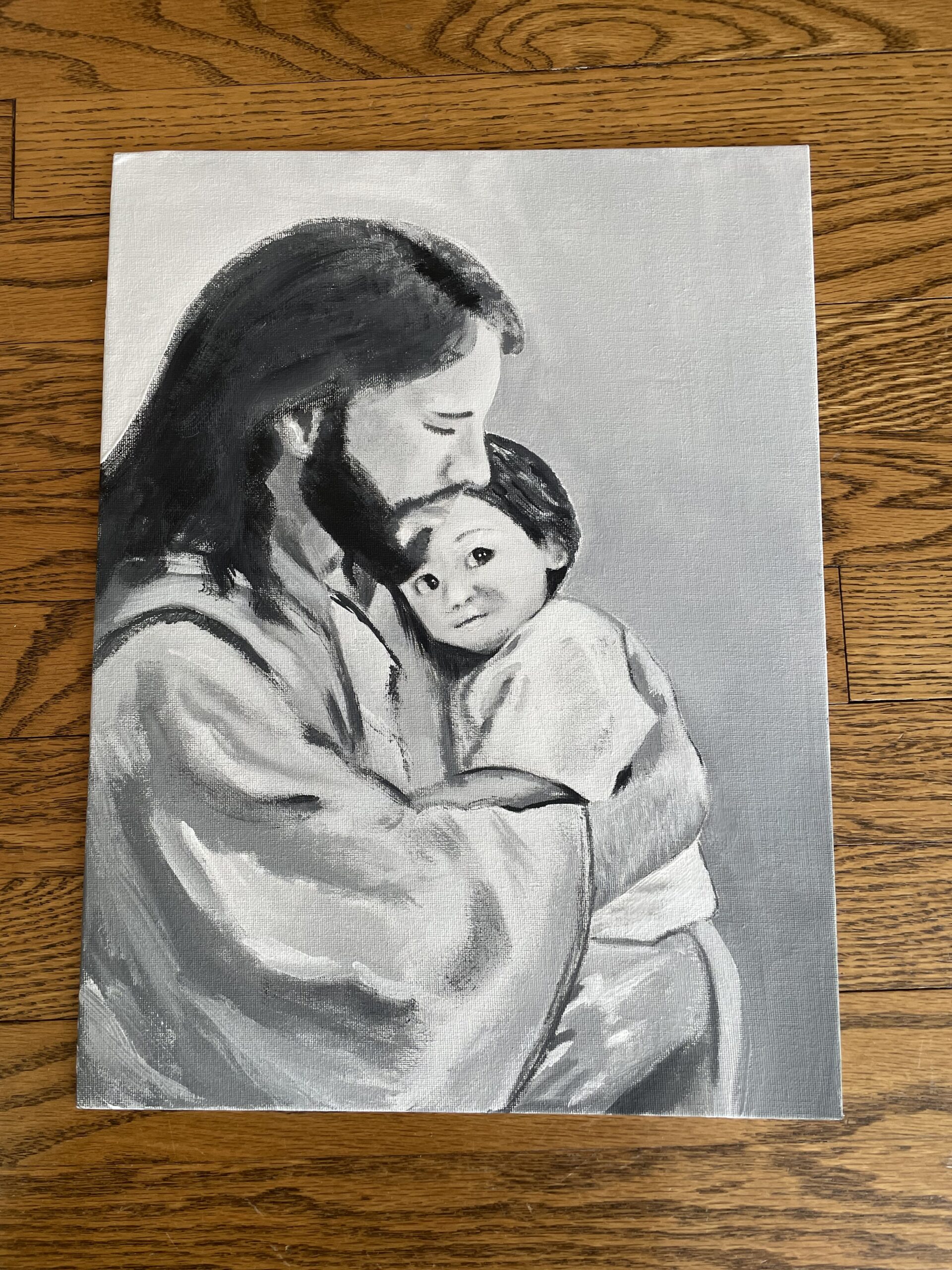 Jesus embraces a cute little child.